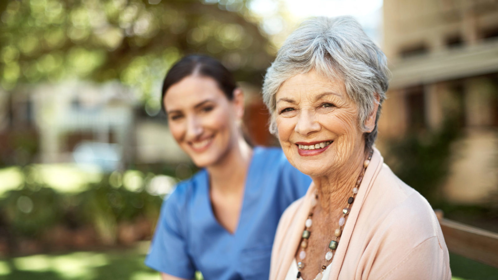 Portrait of a senior woman spending time in the garden with a young nurse