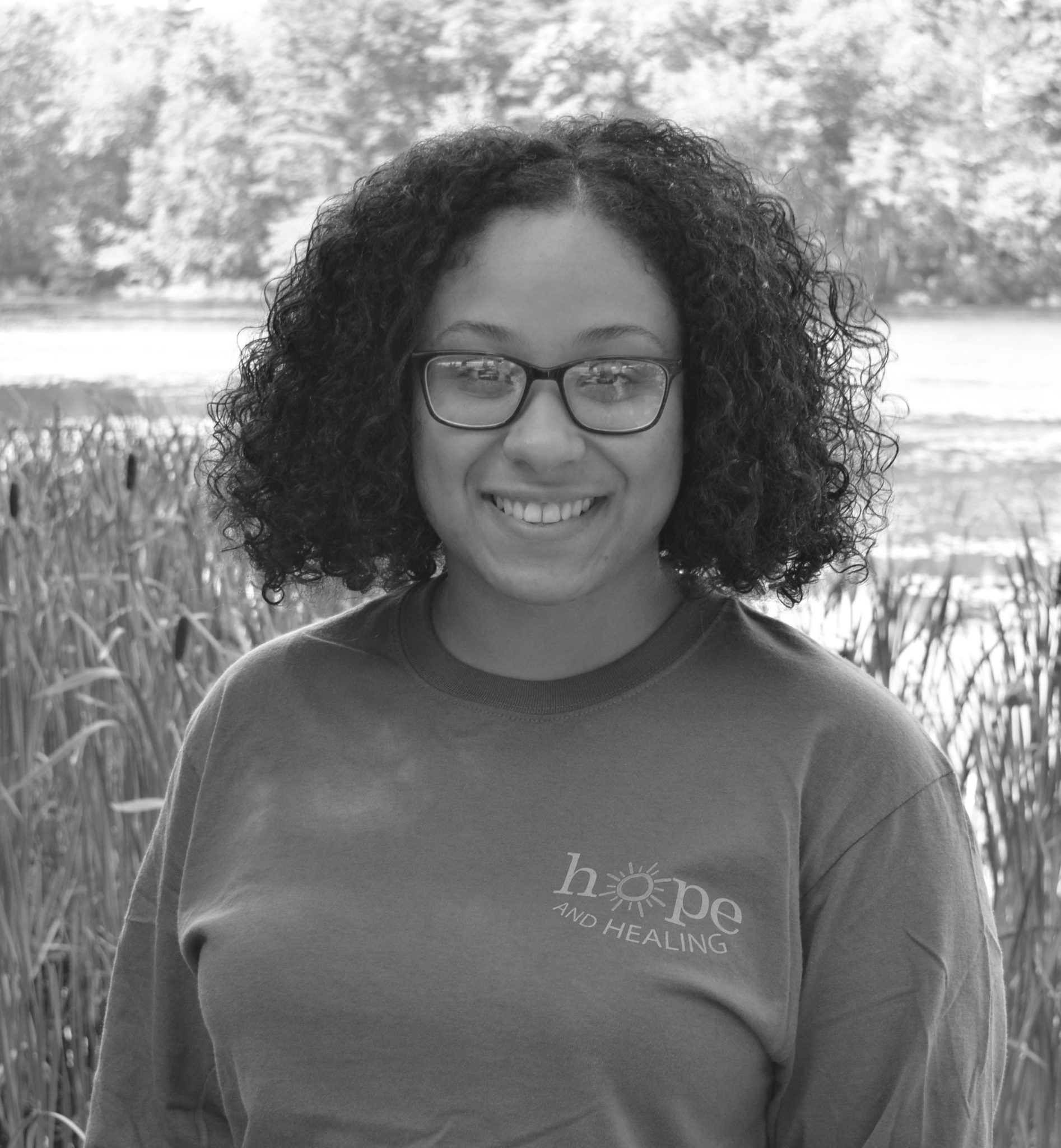 black and white image of girl in glasses