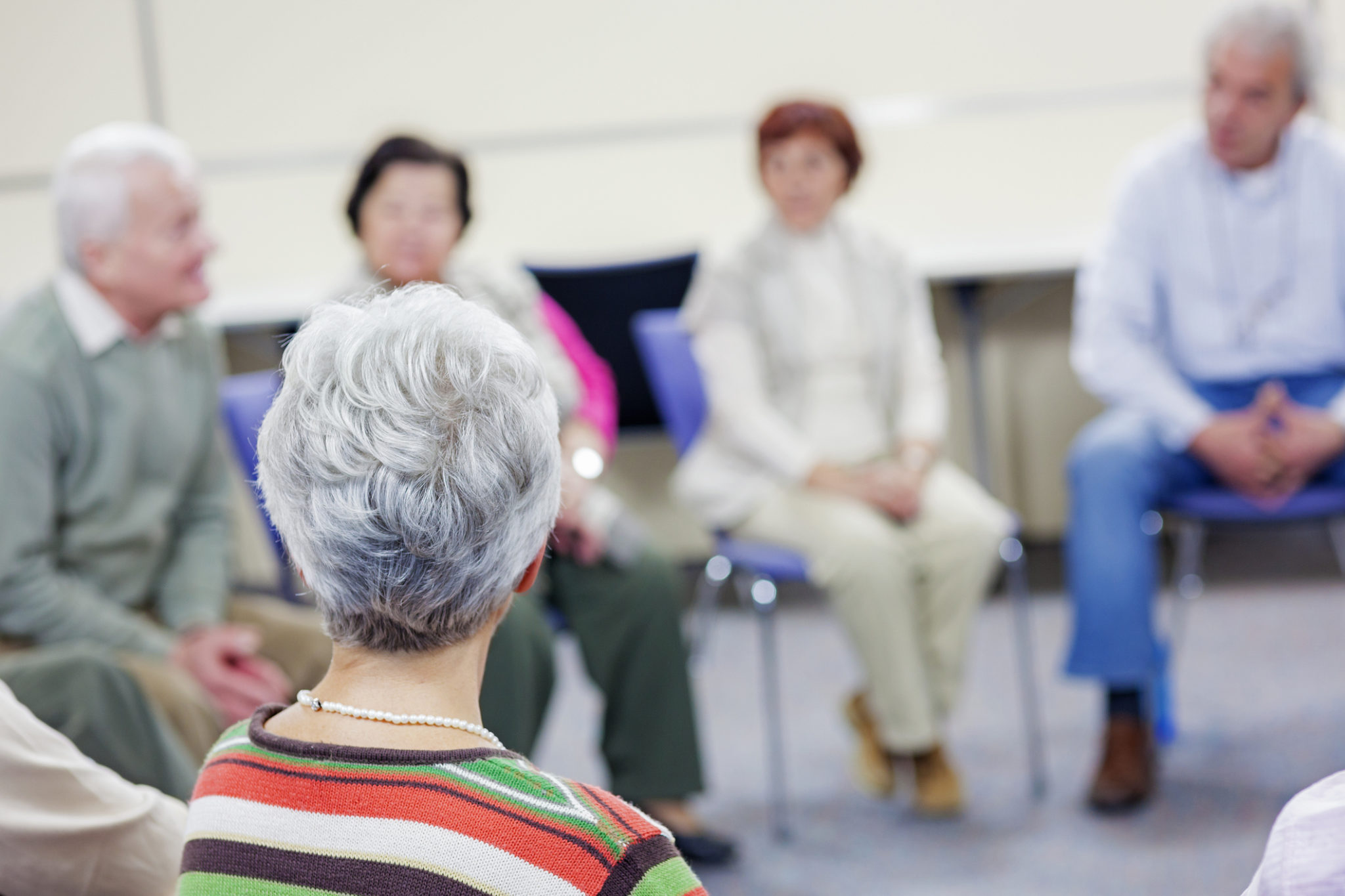 Seniors on a group therapy talking.