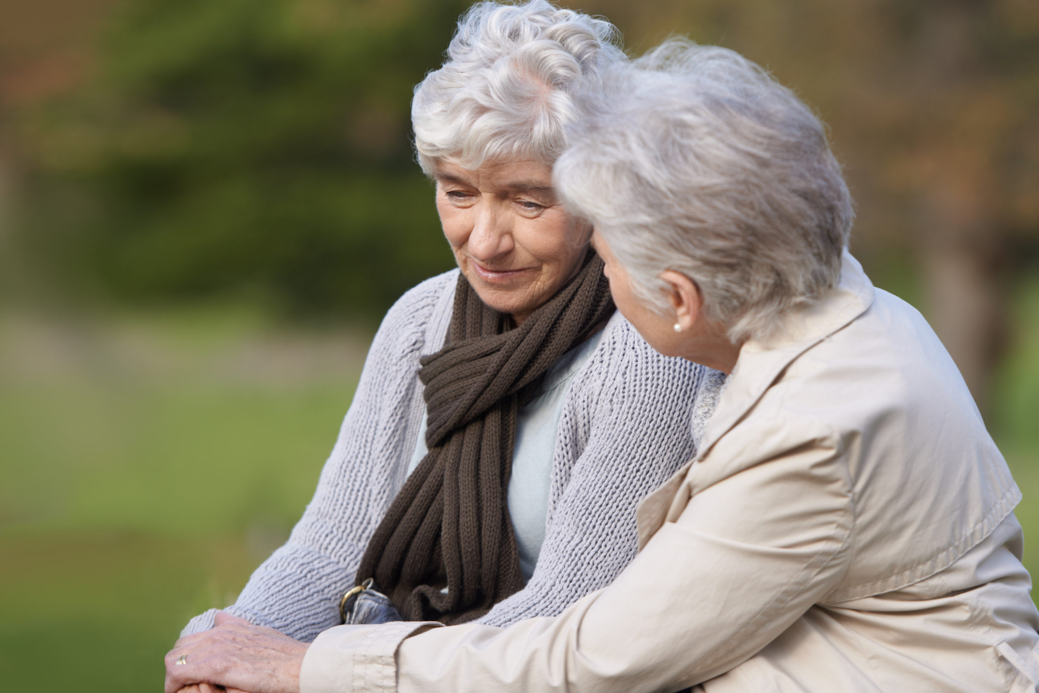 Cropped view of a senior woman caring for her friend