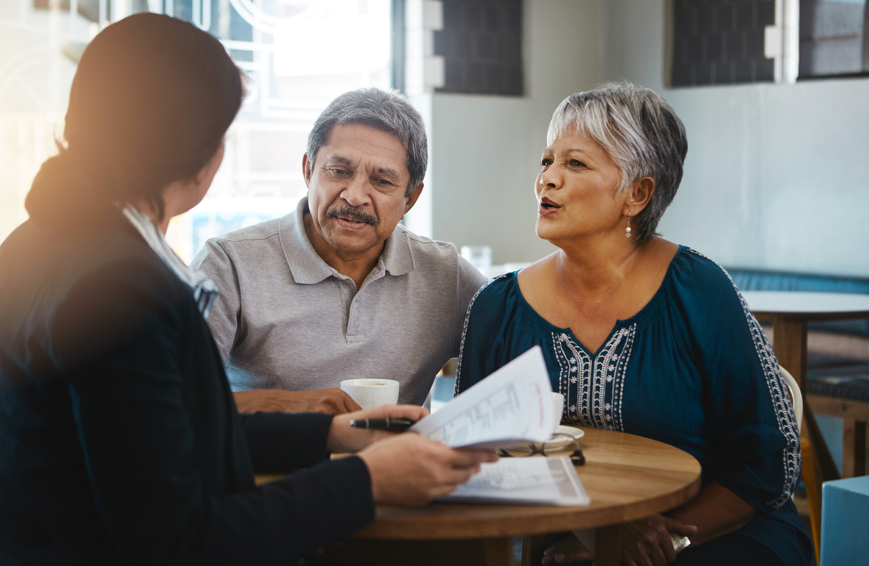 Shot of a senior couple meeting up with a financial advisor