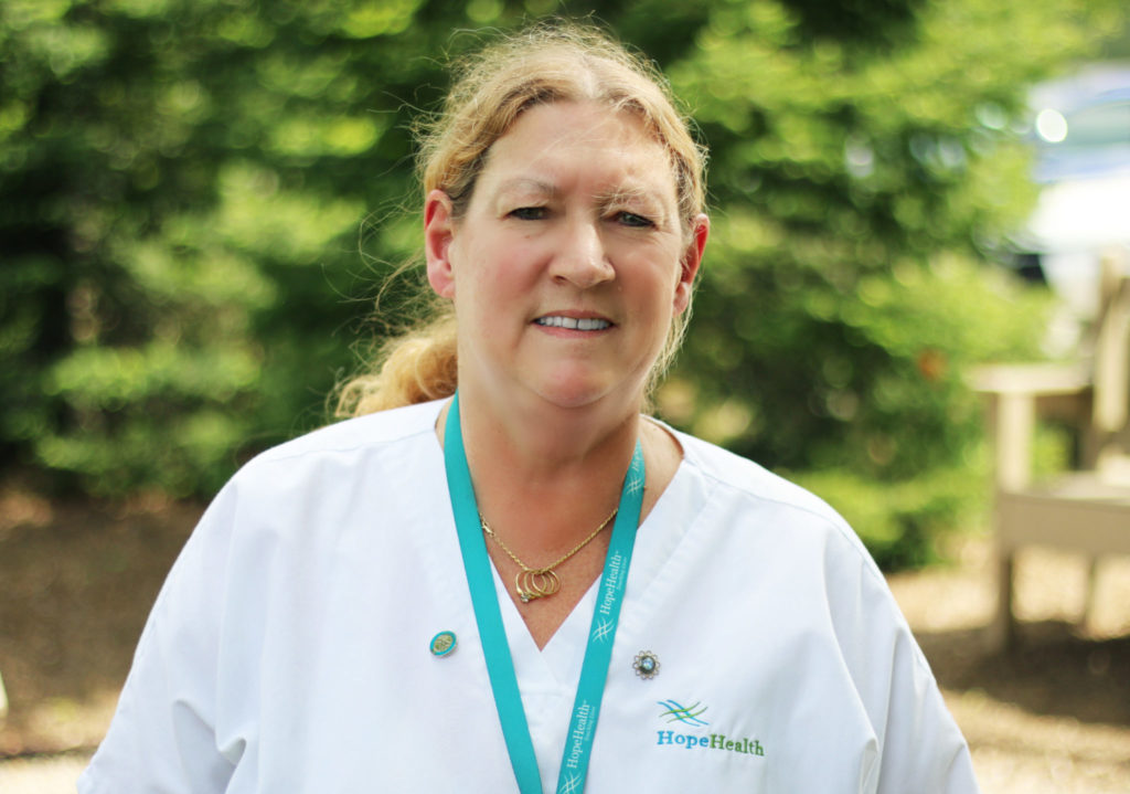 Elaine B, home care aide Female home care aide smiling in uniform