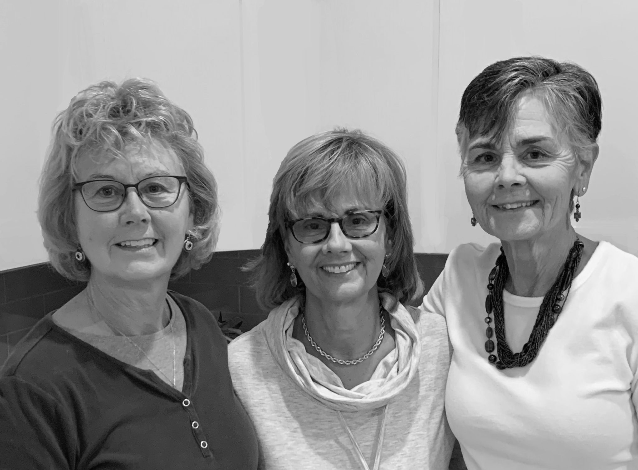 Hosley3 (1) Black and white photo of three women smiling