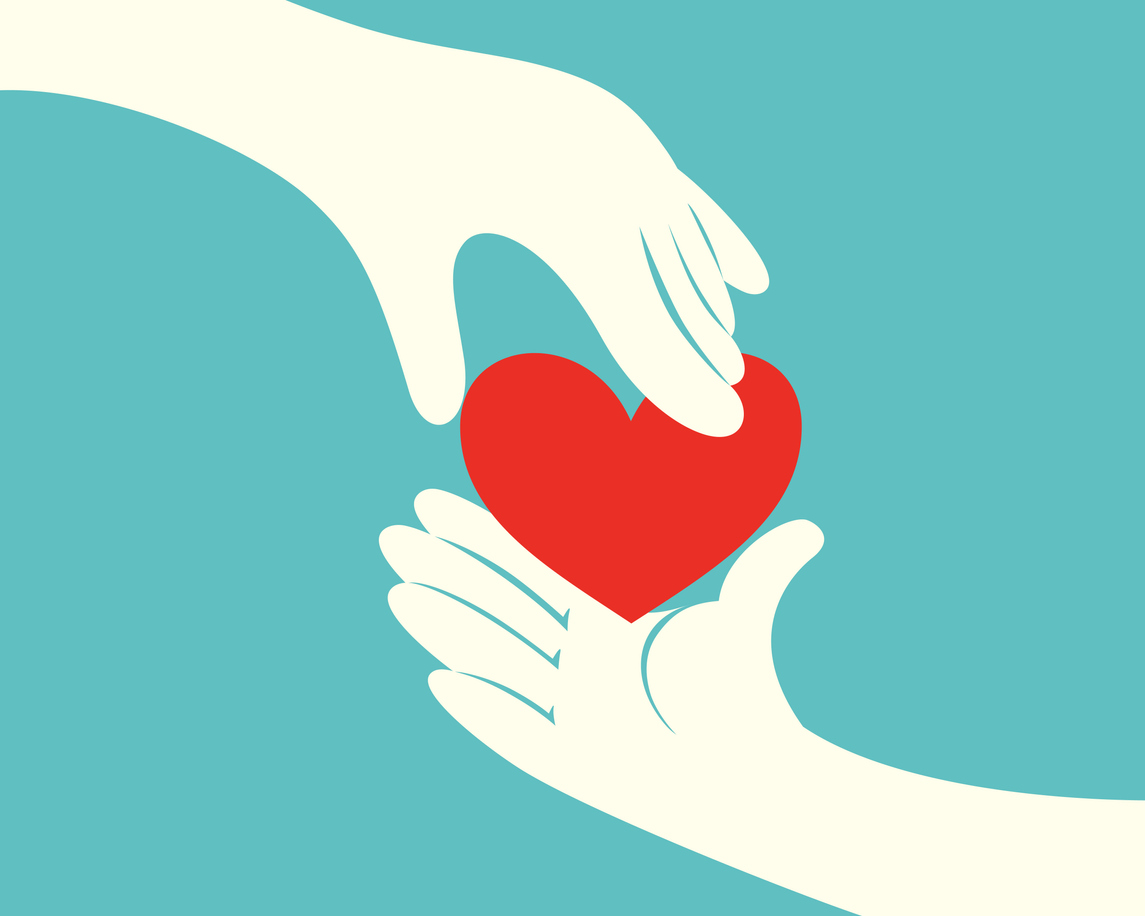 Close up of hand giving a red heart to another hand on green background