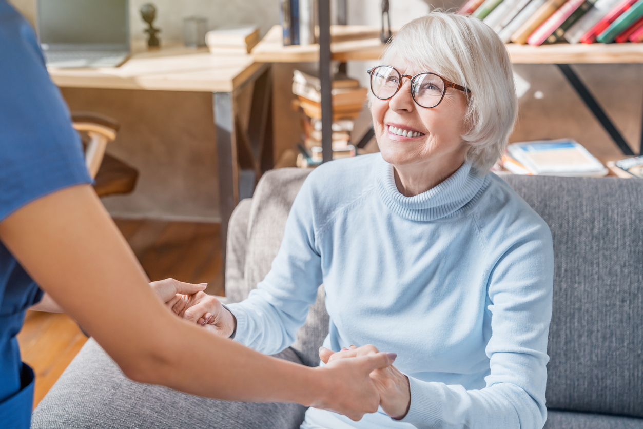 Cropped image of female professional caregiver taking care of elderly woman at home Senior Adult, Nurse, Patient, Care, Assistance