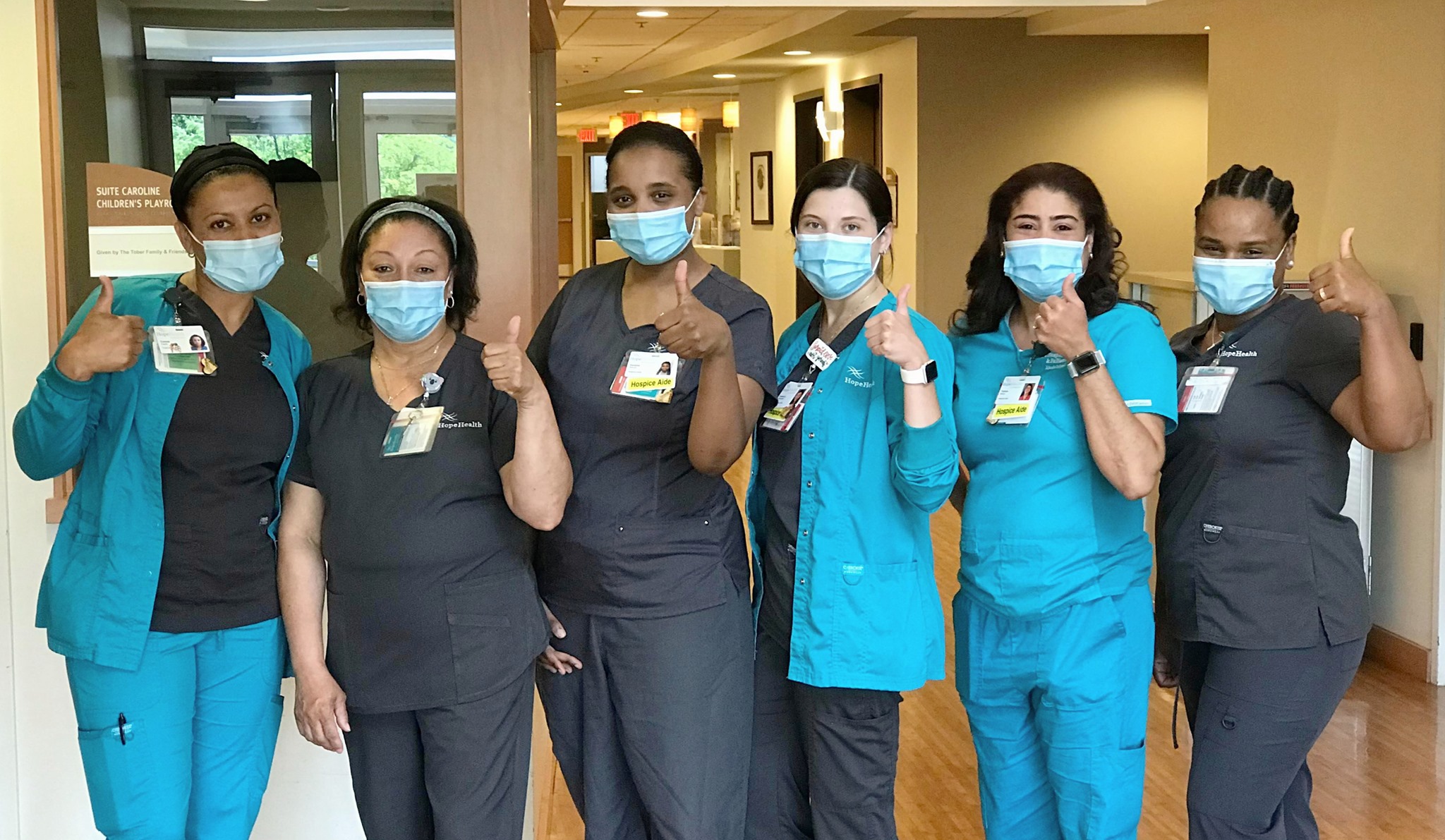 team photo of clinicians wearing personal protective equipment