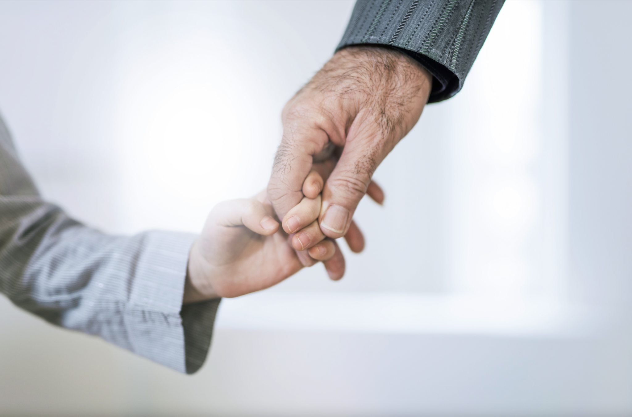 holding hands kid and elderly person