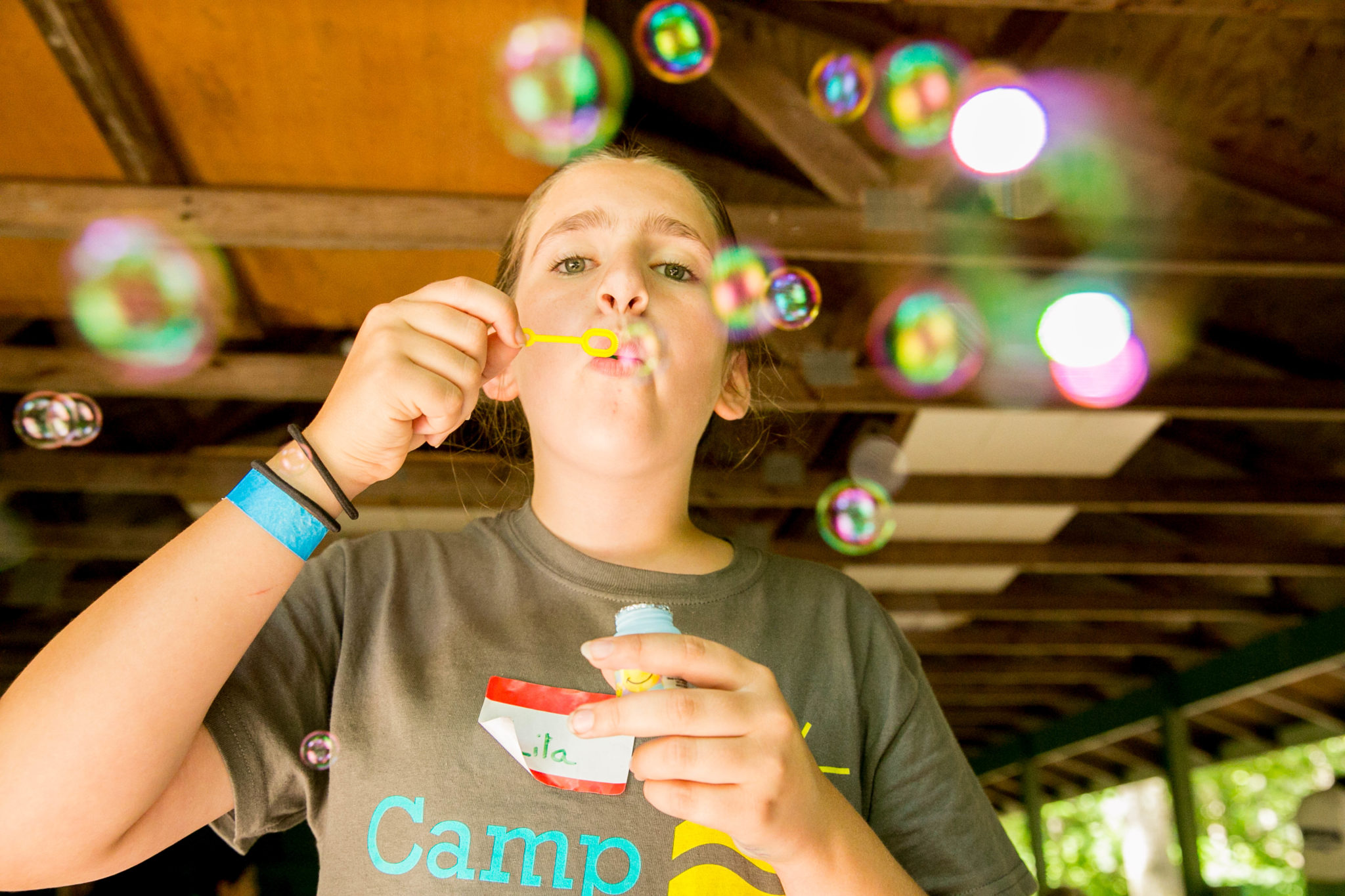 girl blowing bubbles