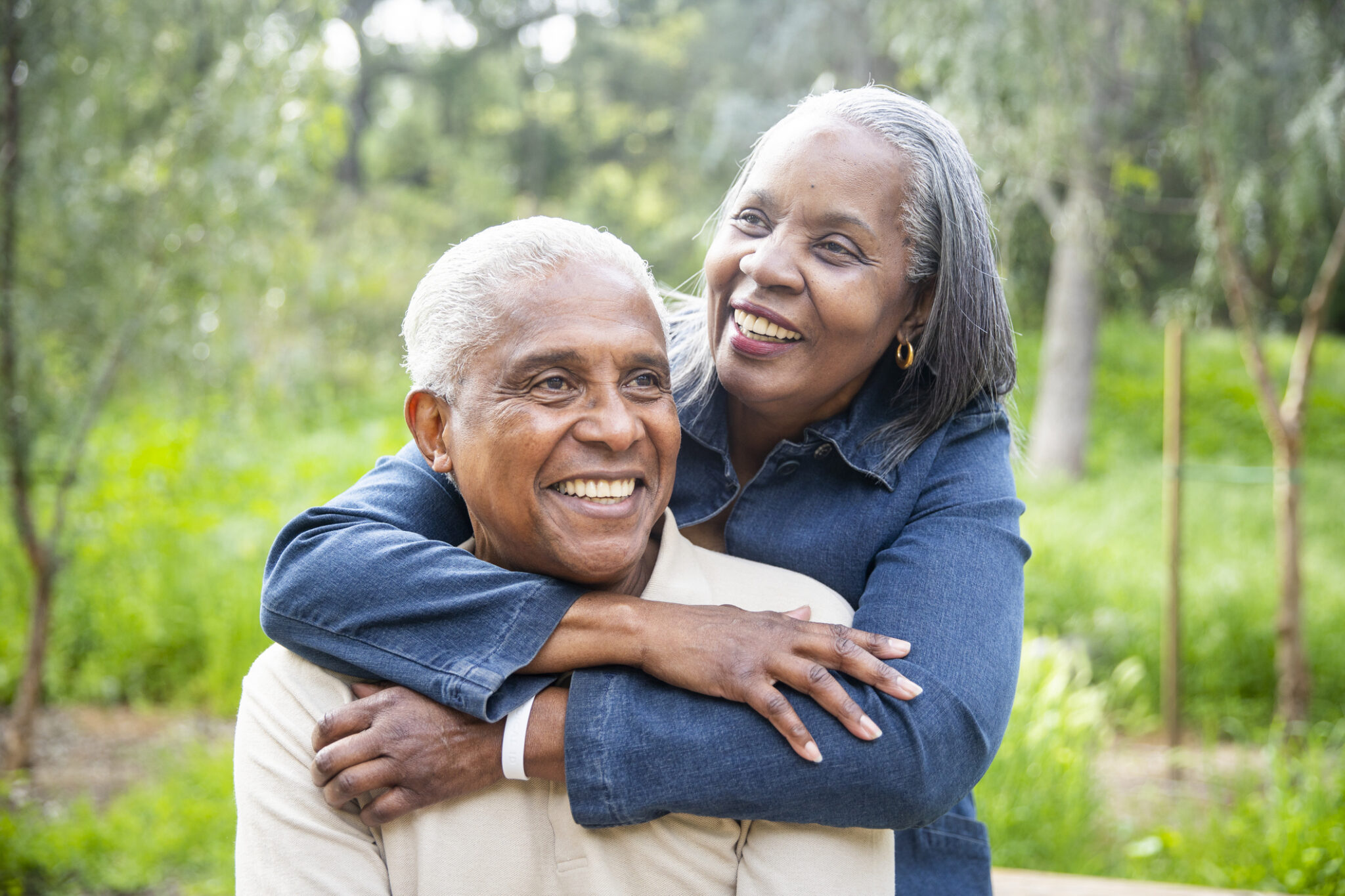 Senior Black Couple Piggyback Ride Outdoors A senior black couple piggyback riding outdoors