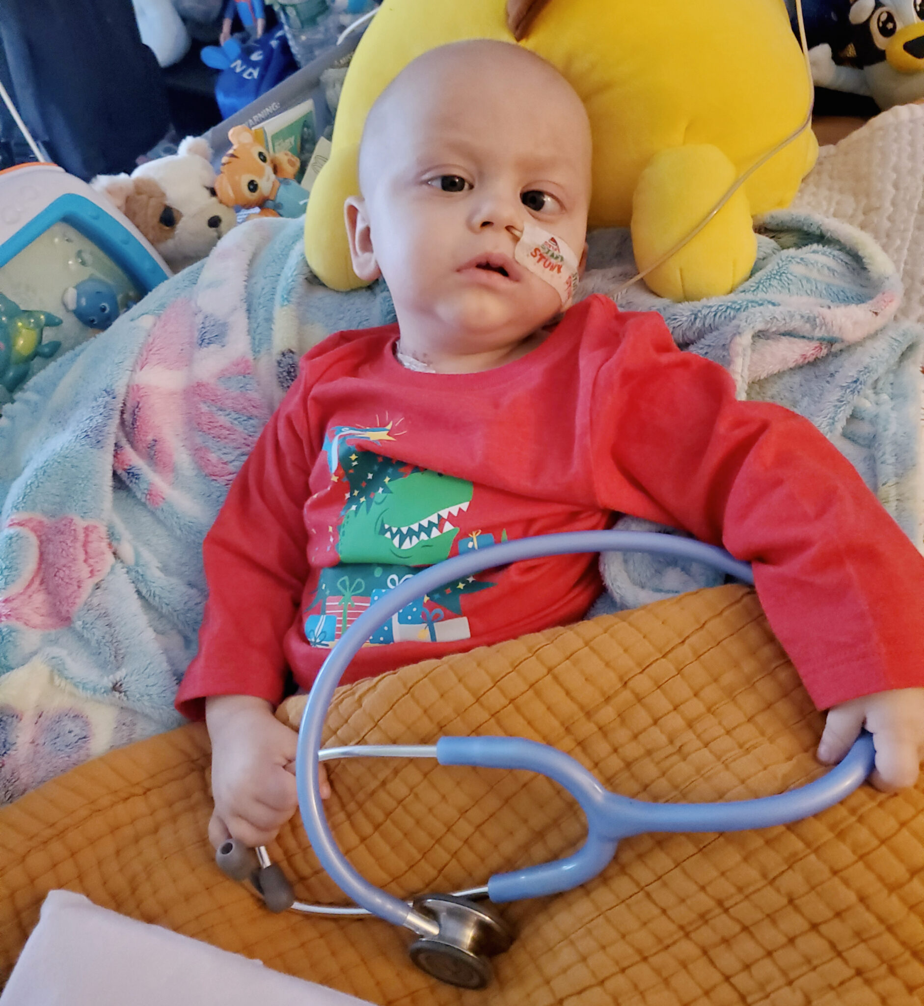Baby boy holding stethoscope