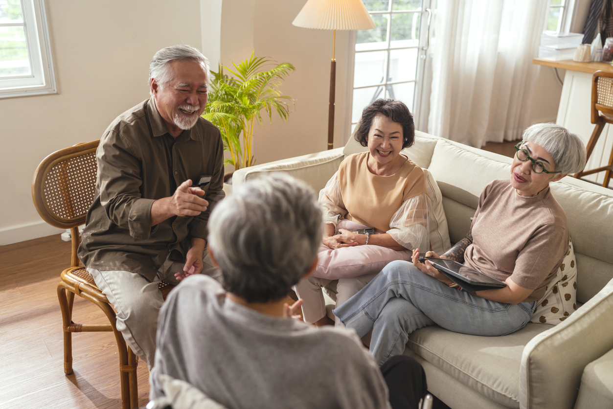 old senior asian friends retired people hapiness positive laugh smile conversation together at living room at nursing home Seniors participating in Group Activities in Adult Daycare Center