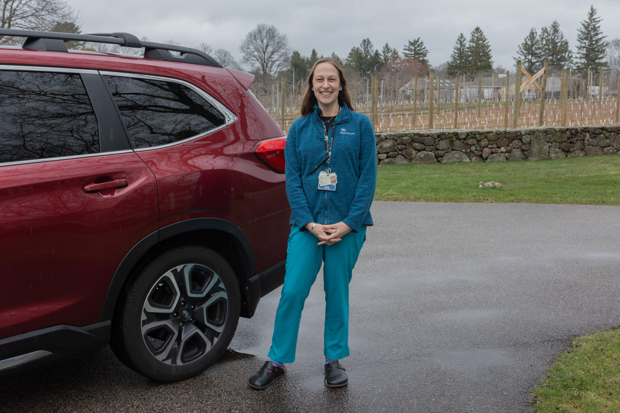 Nurse by her car