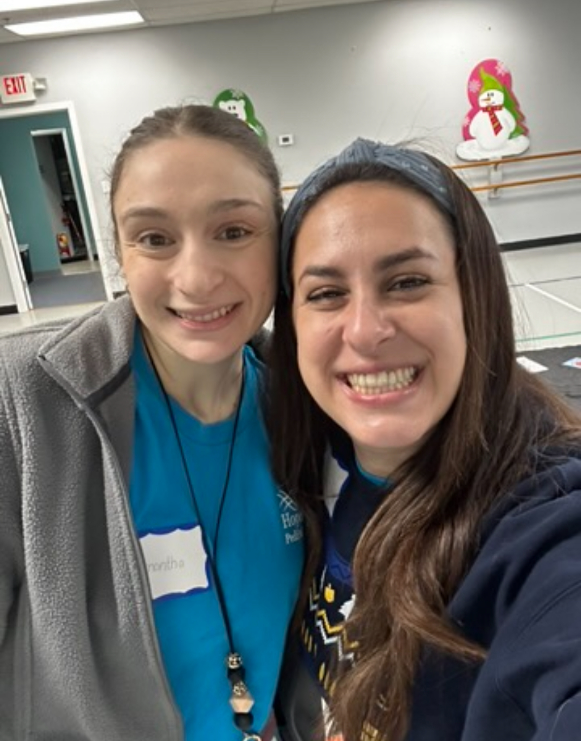 Two women smile togeether for a selfie