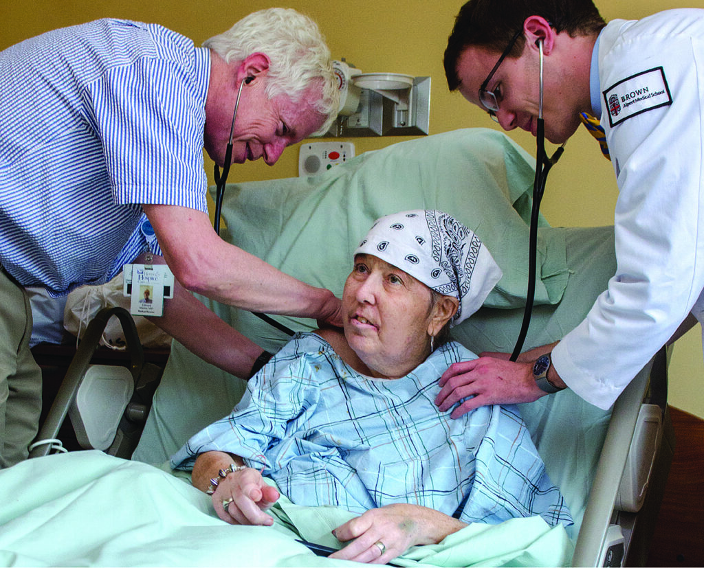 At the bedside, Dr. Martin guides a medical student from Brown University—a reflection of our long-standing teaching affiliation with Brown Medical School.
