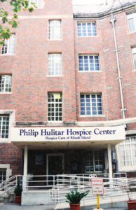 Brick building with title "Philip Hulitar Hospice Center"