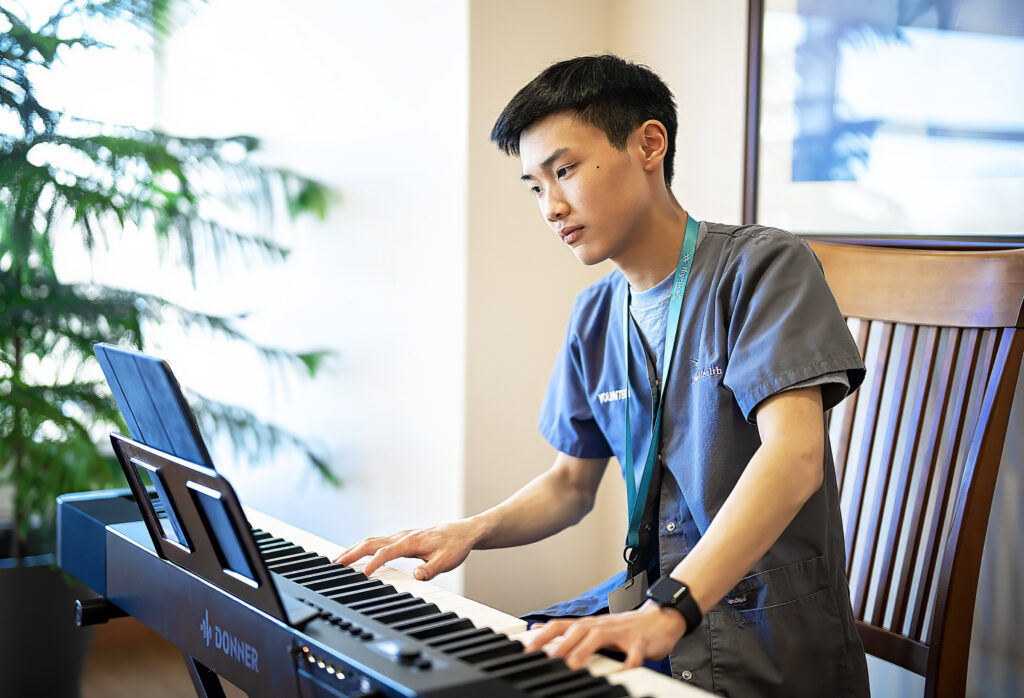 PROVIDENCE, RI—Saturday, April 11, 2026—Nathan Woo playing in a dining area on the 3rd floor at HopeHealth. Photo Glenn Osmundson