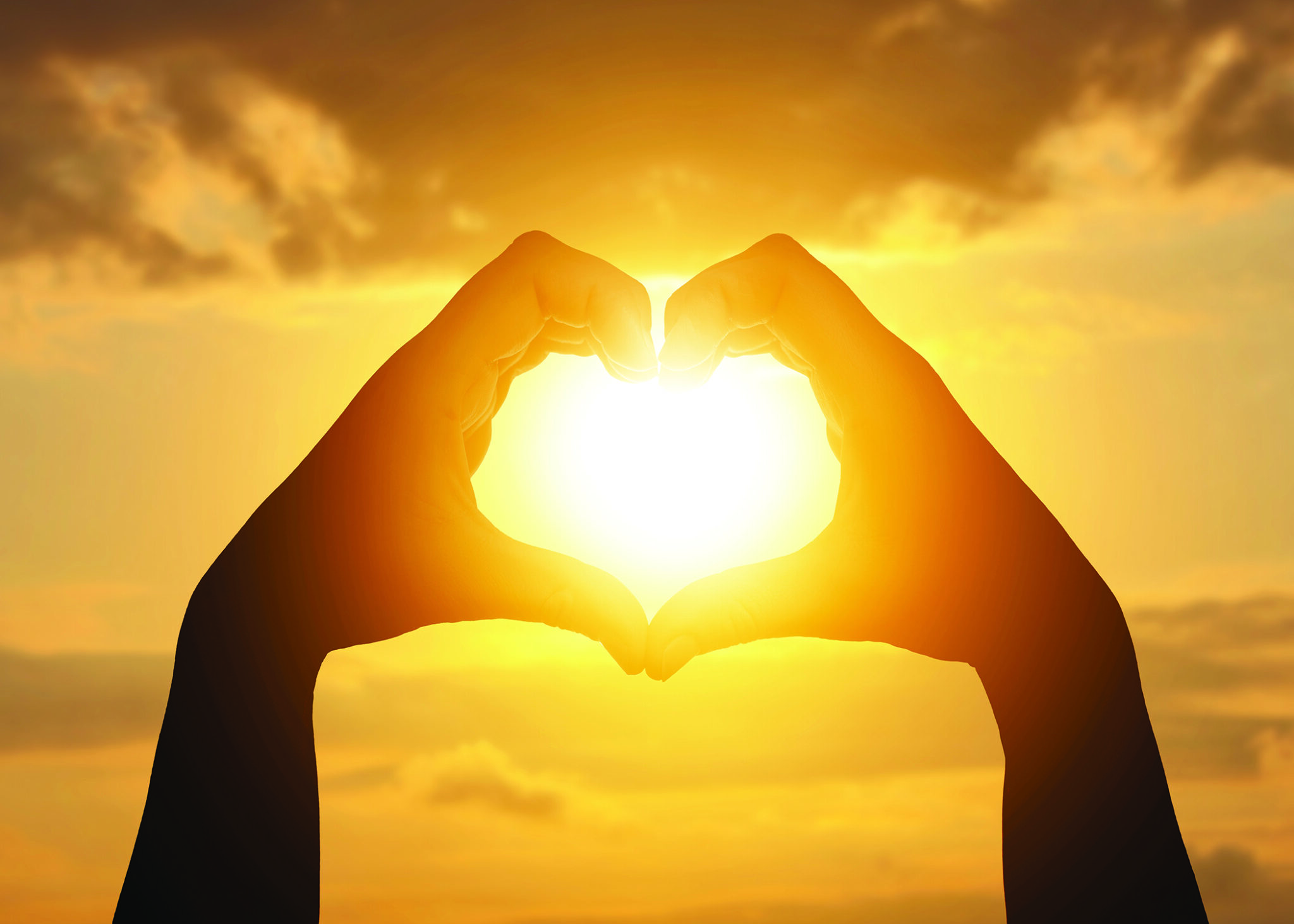 Hope.,Sun,Shining,Through,Heart,Made,Of,Woman's,Hands,Against