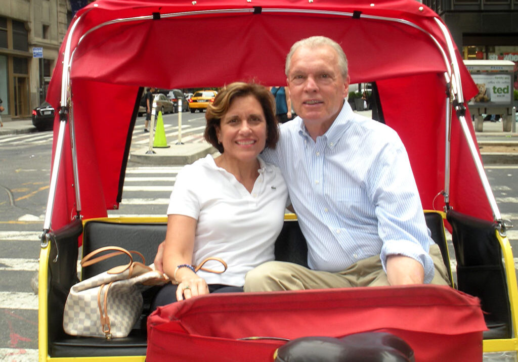 Woman and man in a red pedicab