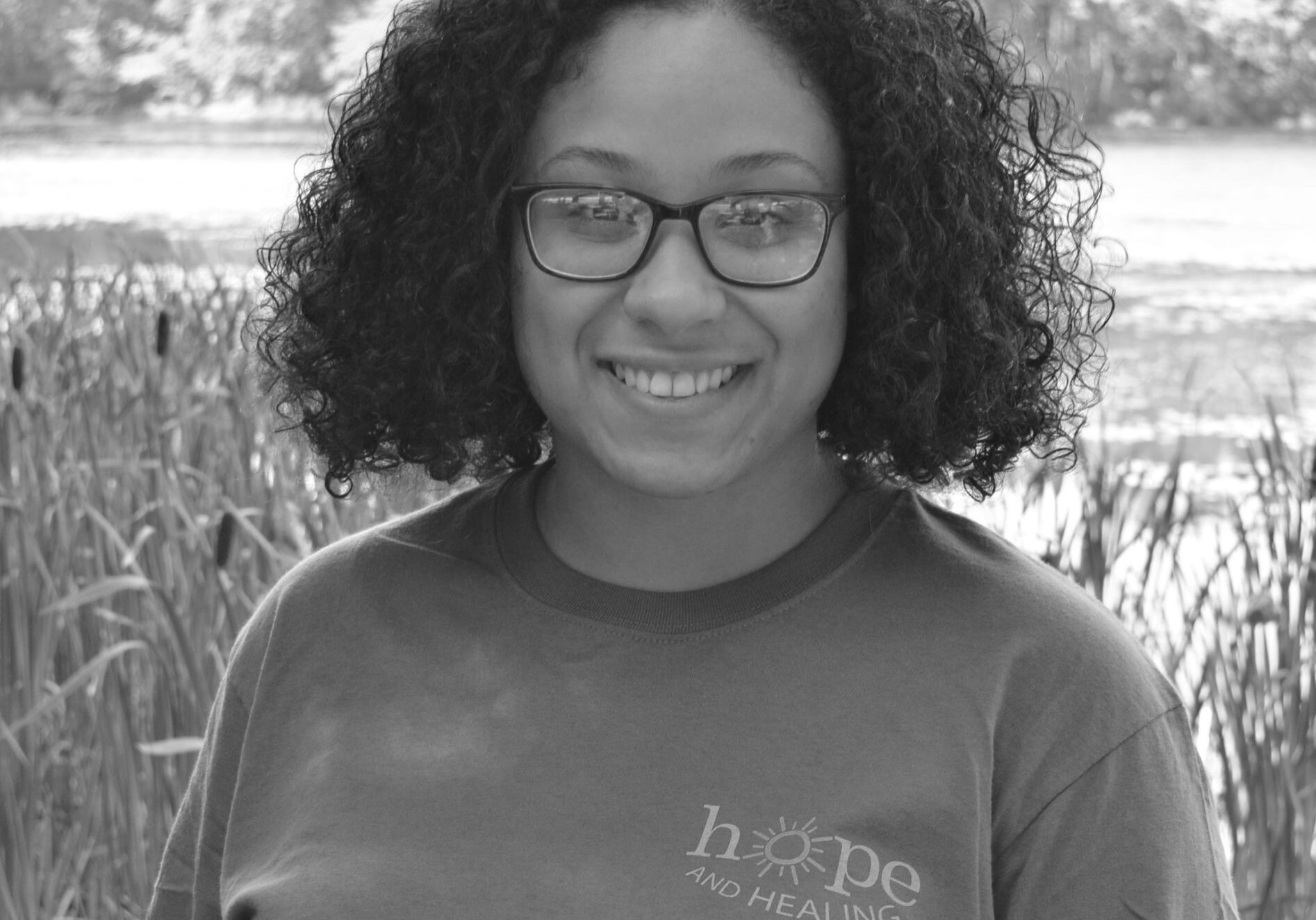 black and white image of girl in glasses