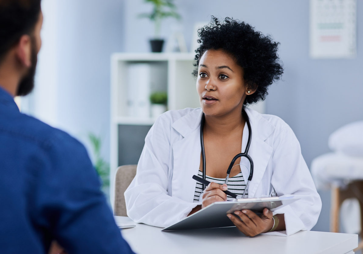 She takes her time to listen to your concerns Female palliative care doctor discussing goals of care with a male patient