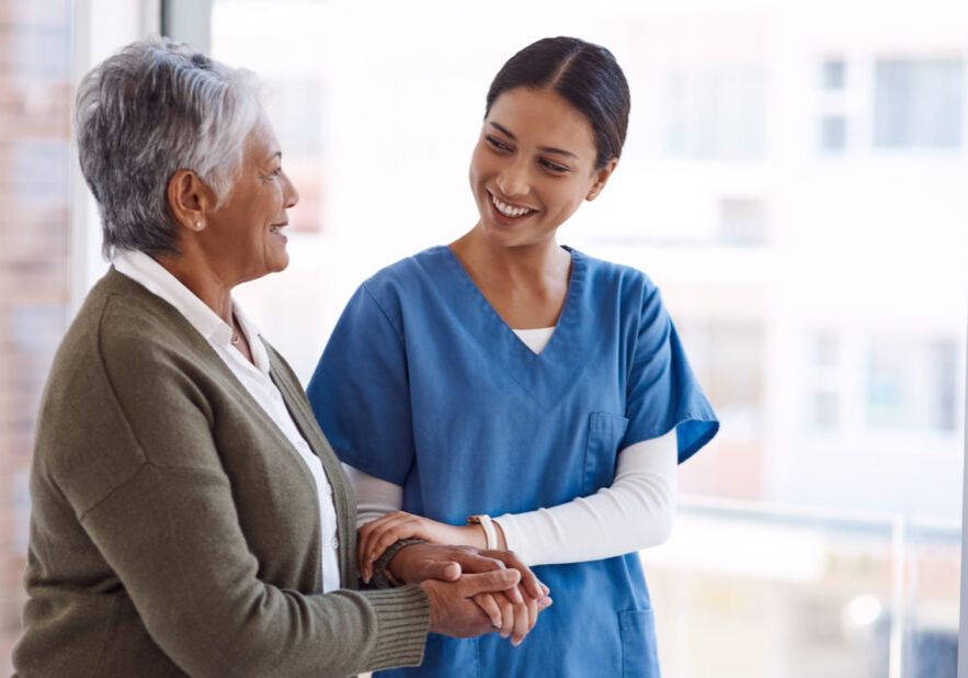 Shot of a young nurse caring for a senior woman