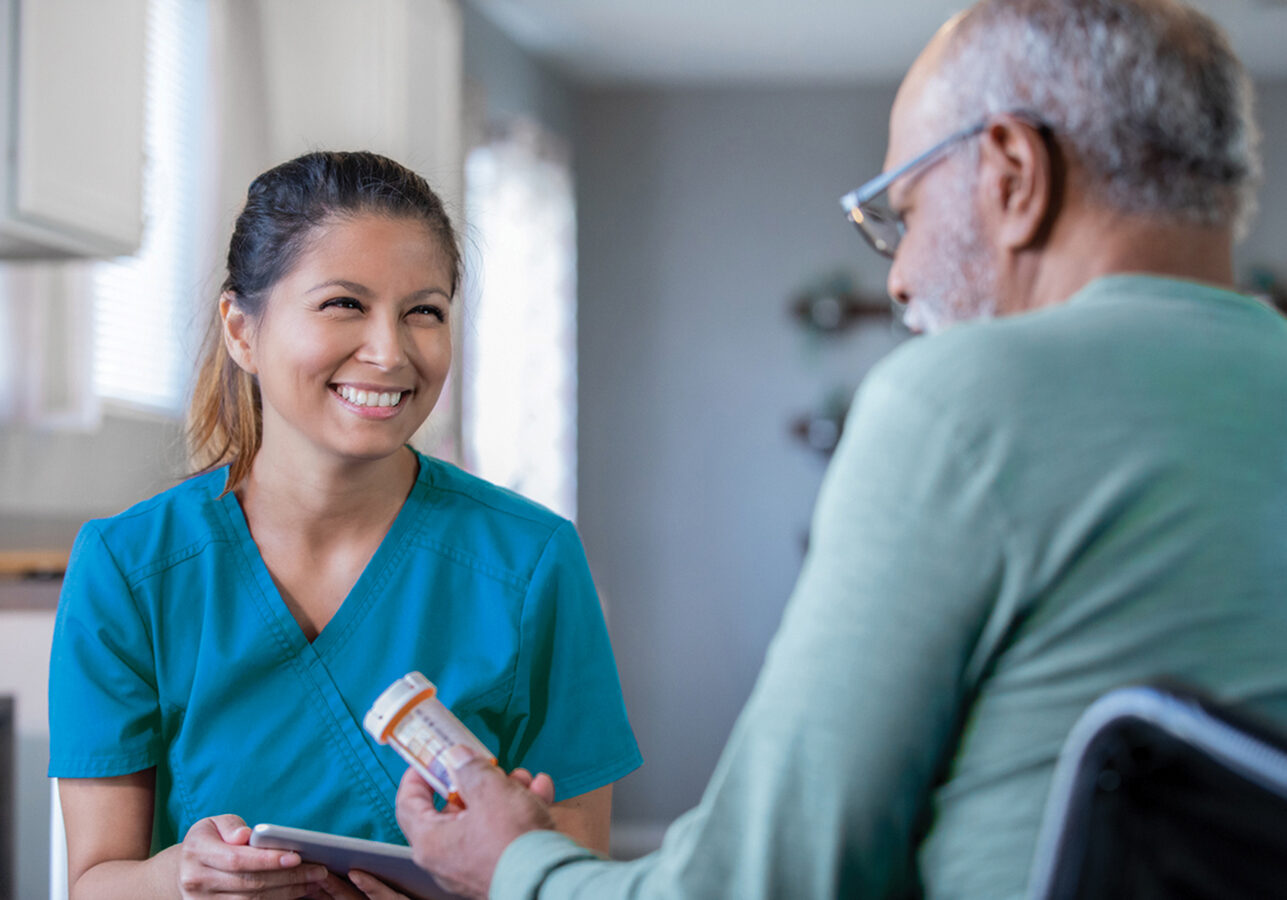 Home healthcare nurse brings new prescriptions for senior man