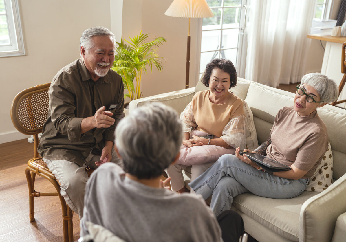 old senior asian friends retired people hapiness positive laugh smile conversation together at living room at nursing home Seniors participating in Group Activities in Adult Daycare Center
