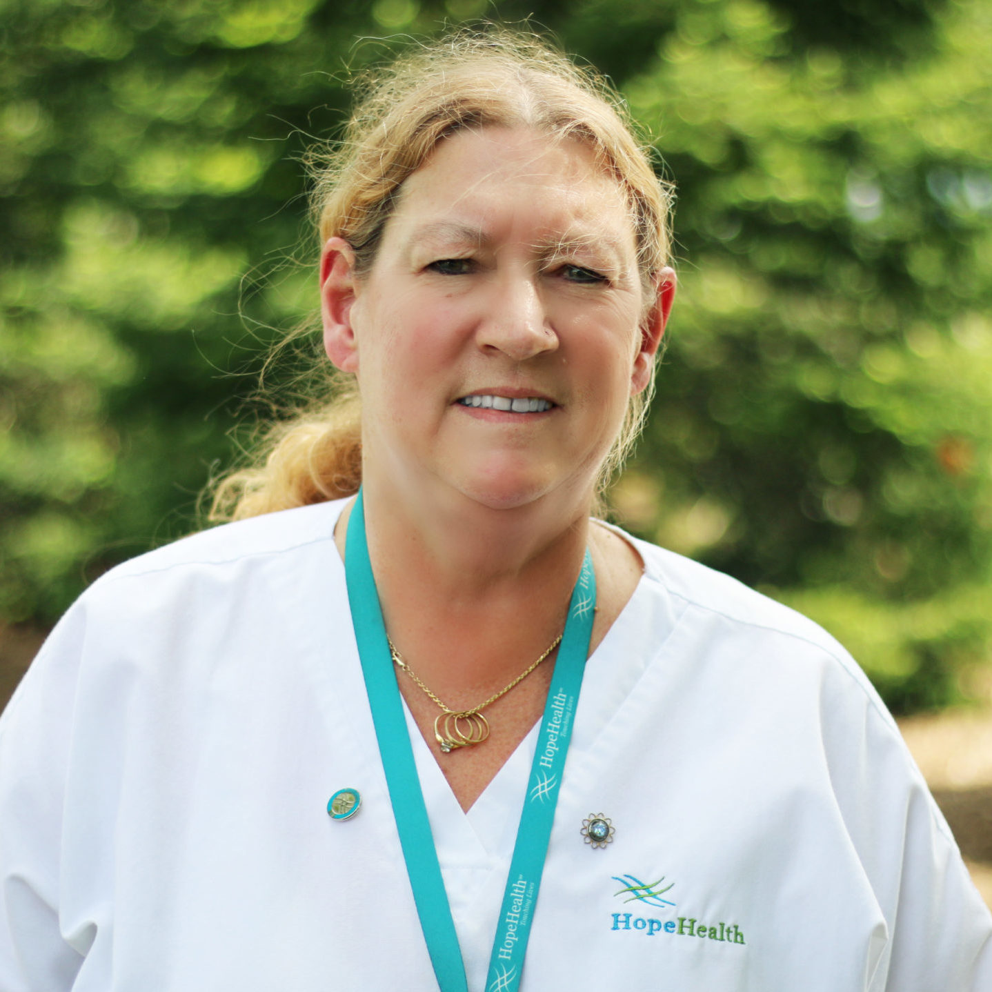 Elaine B, home care aide Female home care aide smiling in uniform