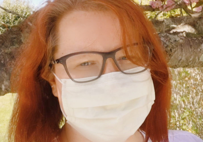 thumbnail_image0 (3) Hospice nurse wearing personal protective equipment in front of spring blooms
